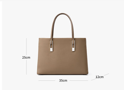 Woman carrying stylish genuine leather tote bag