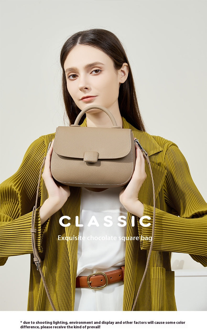 Woman carrying stylish genuine leather bag