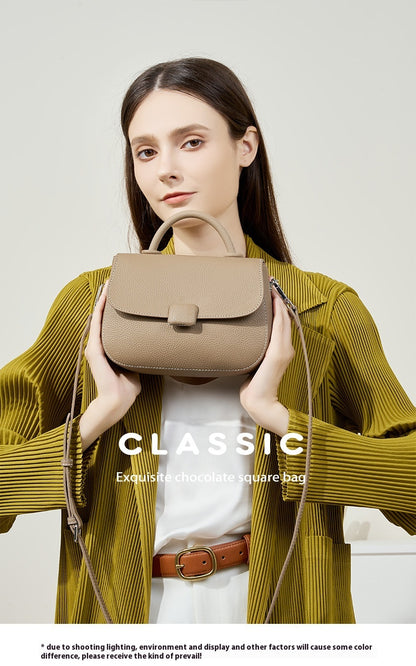 Woman carrying stylish genuine leather bag